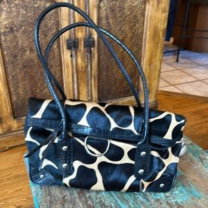 Animal “hair” and leather print bag